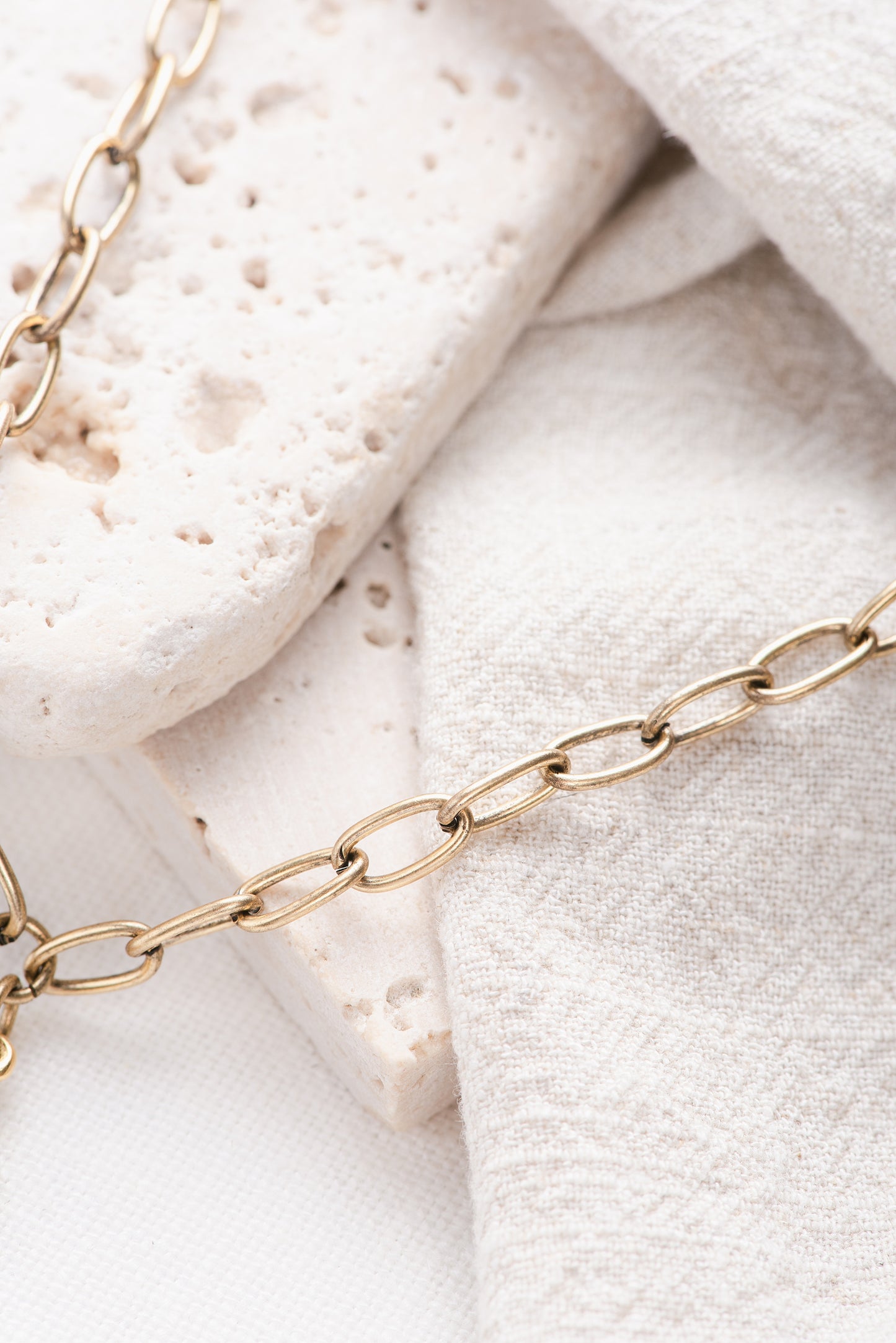 A gold paperclip chain.