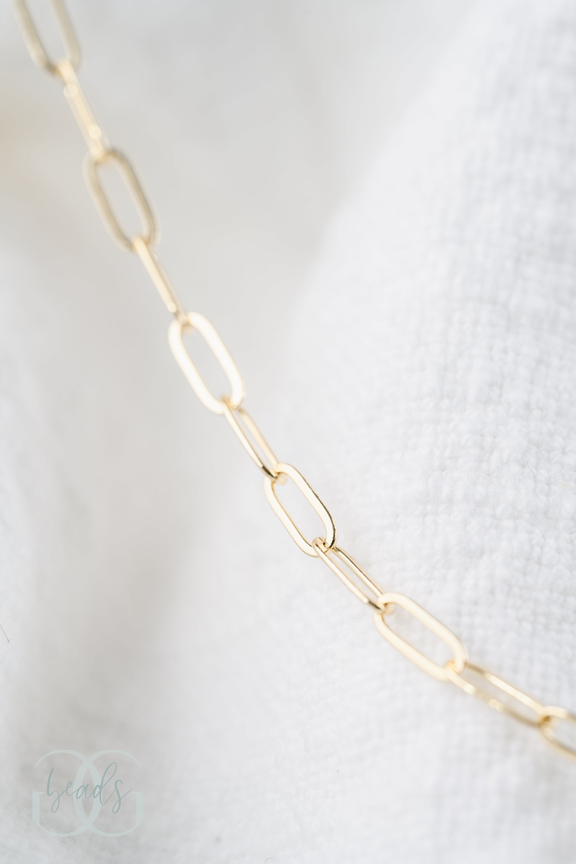 A gold dainty paperclip chain.