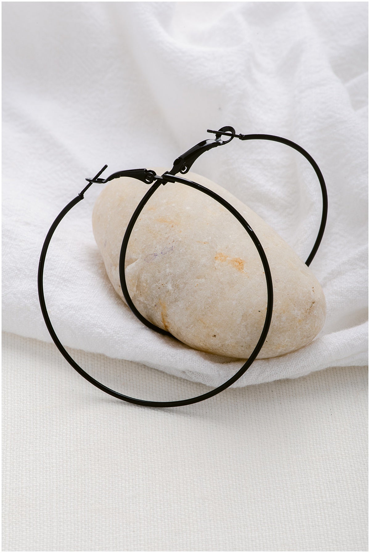 Large, black hoop earrings.