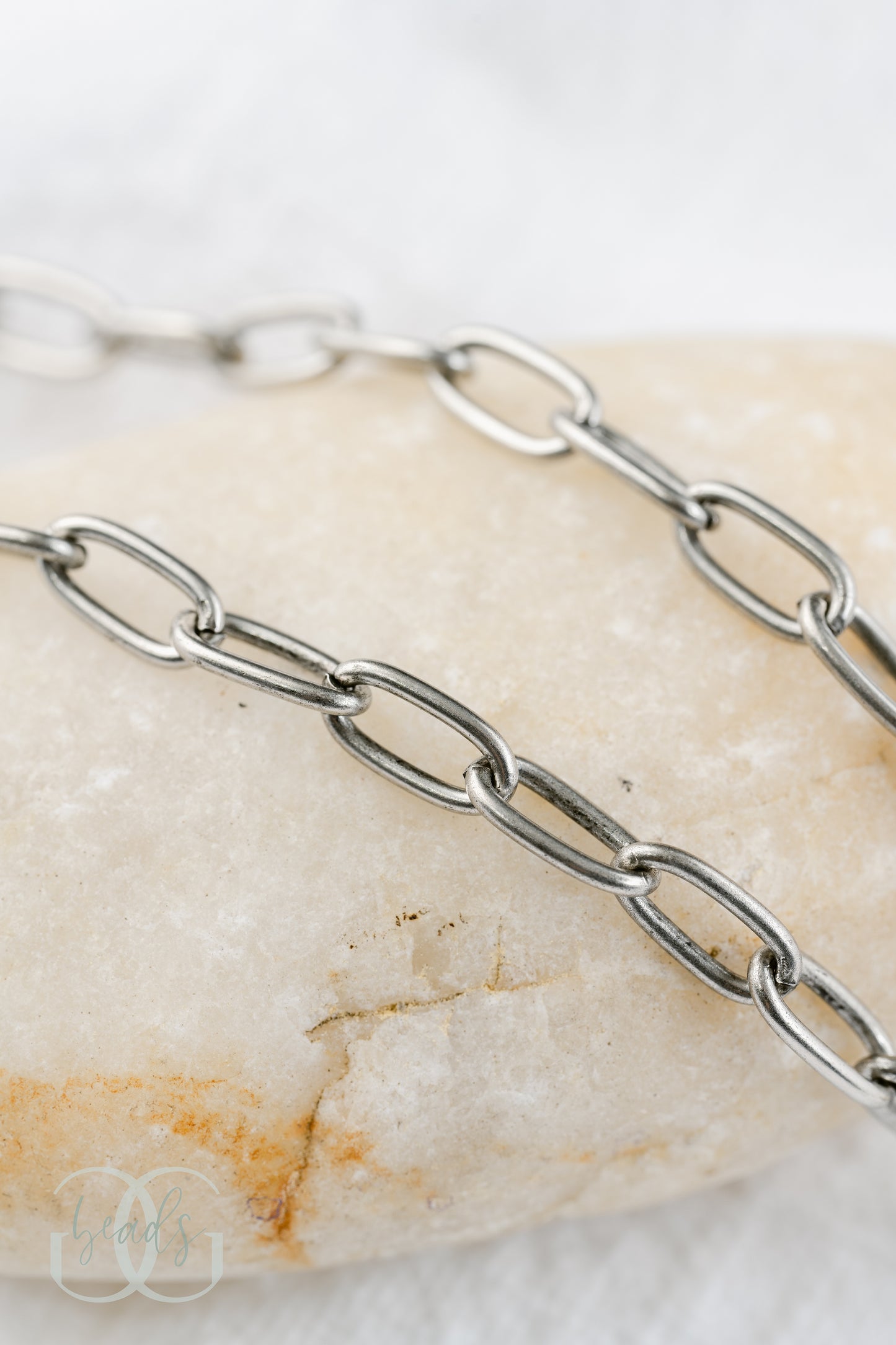 A silver paperclip chain.
